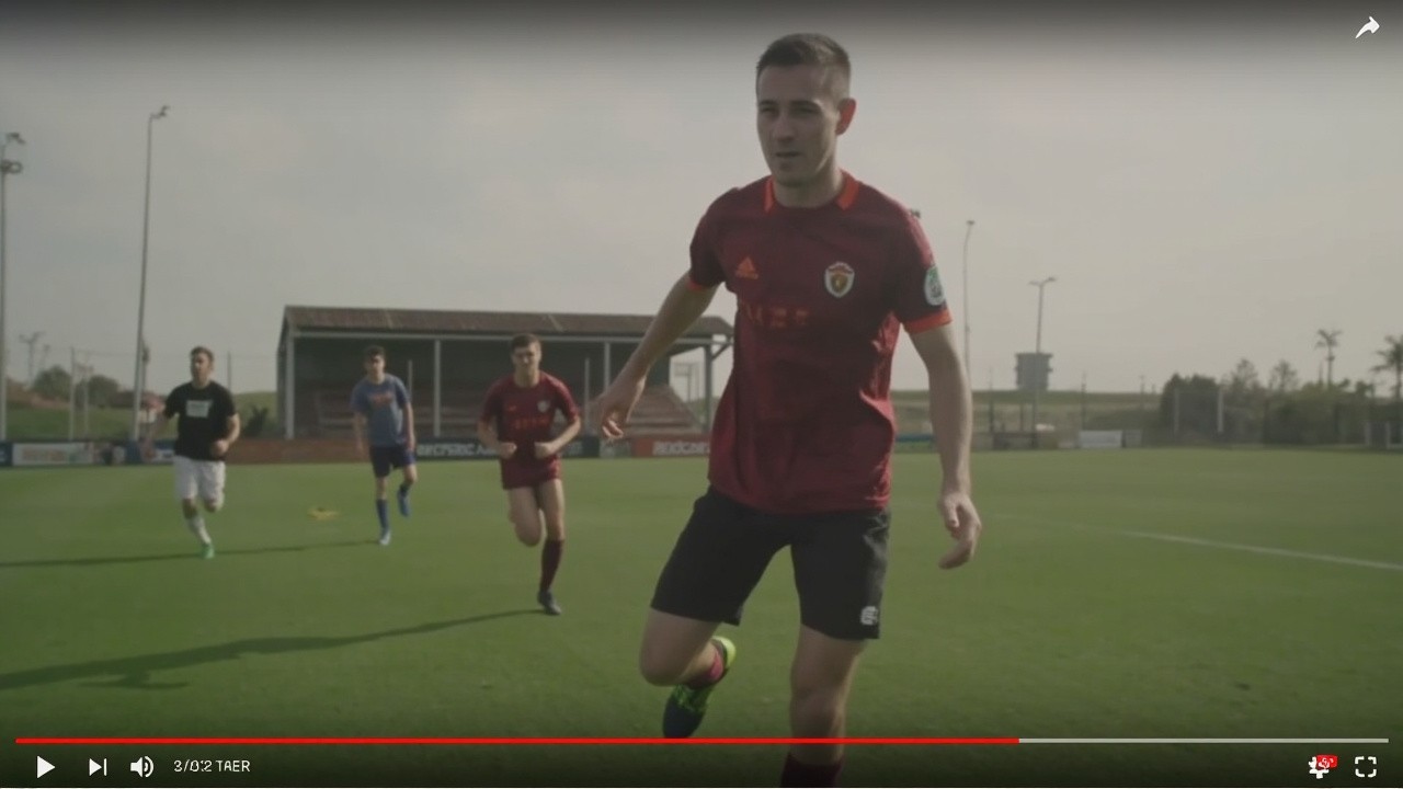 A Kid Playing Football