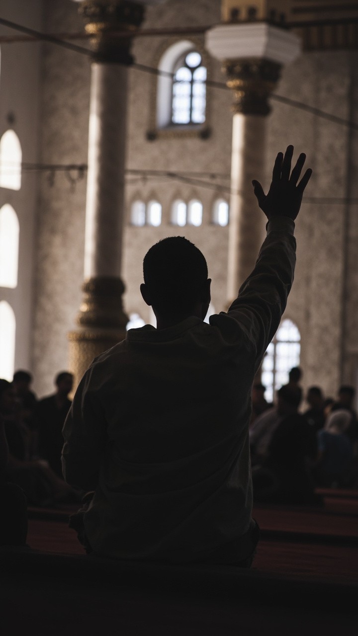 A Man Raising Hand in the Mosque