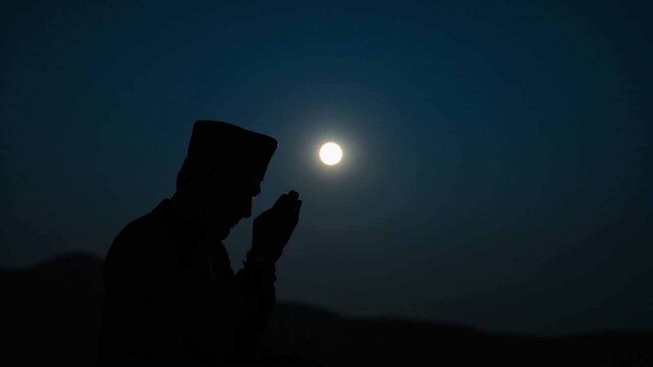 A Muslim Man Praying at Night