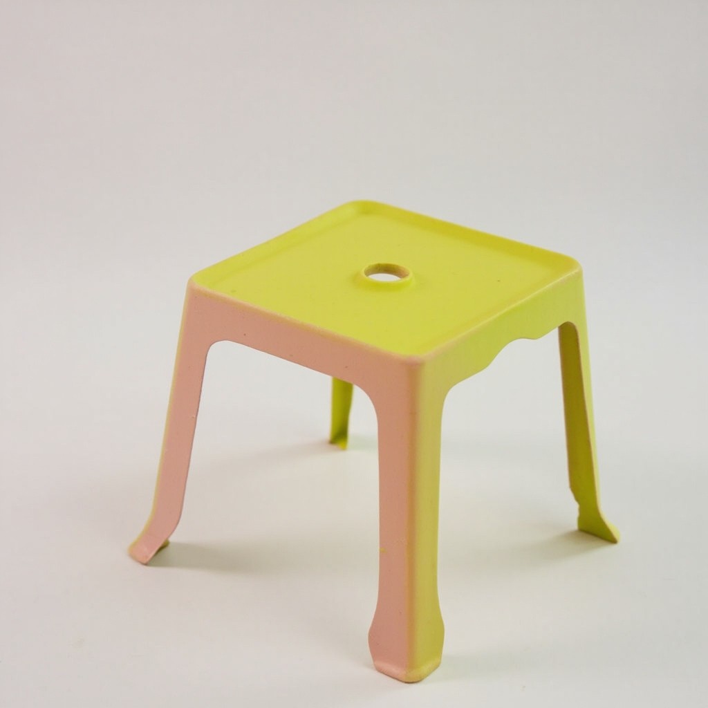 A Plastic Stool with a Central Hole
