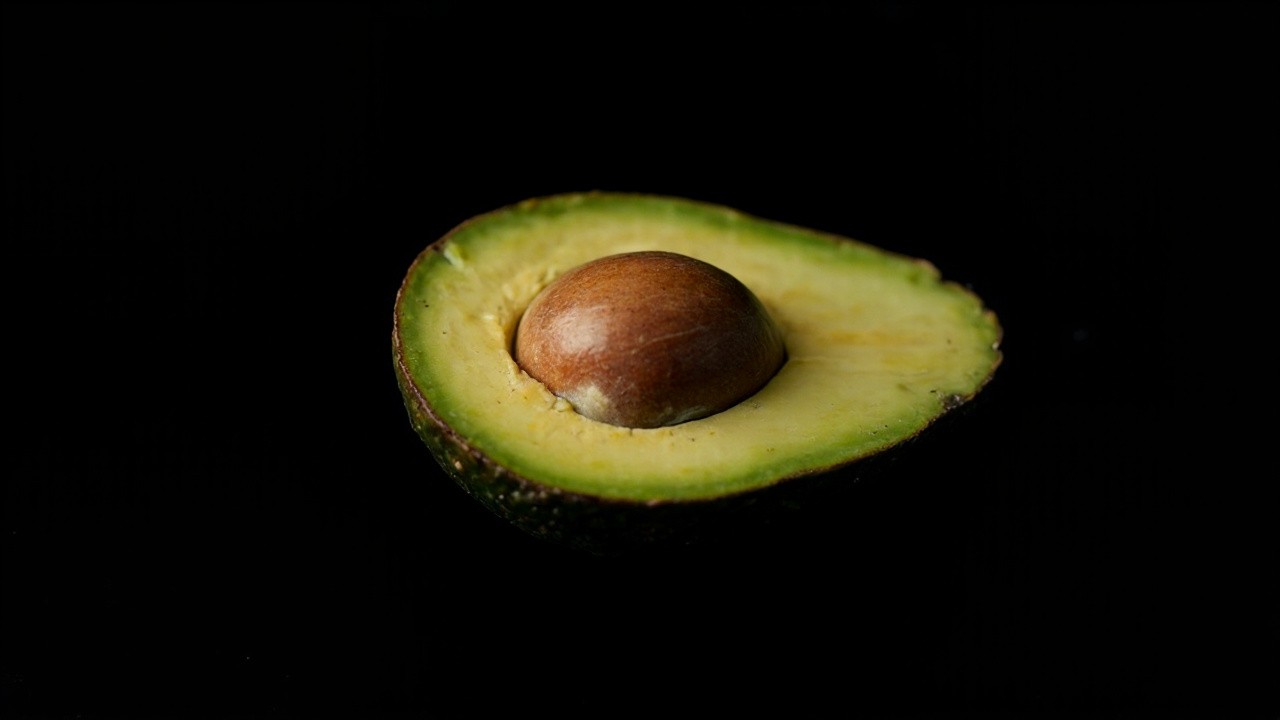 Avocado Halves on Black Background Photoshoot