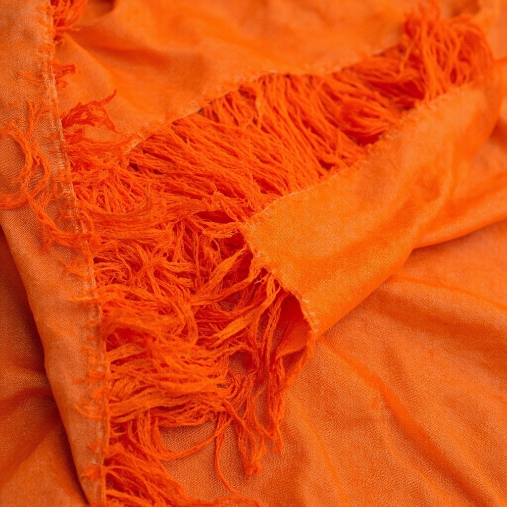 Close-up of Fraying Orange Fabric