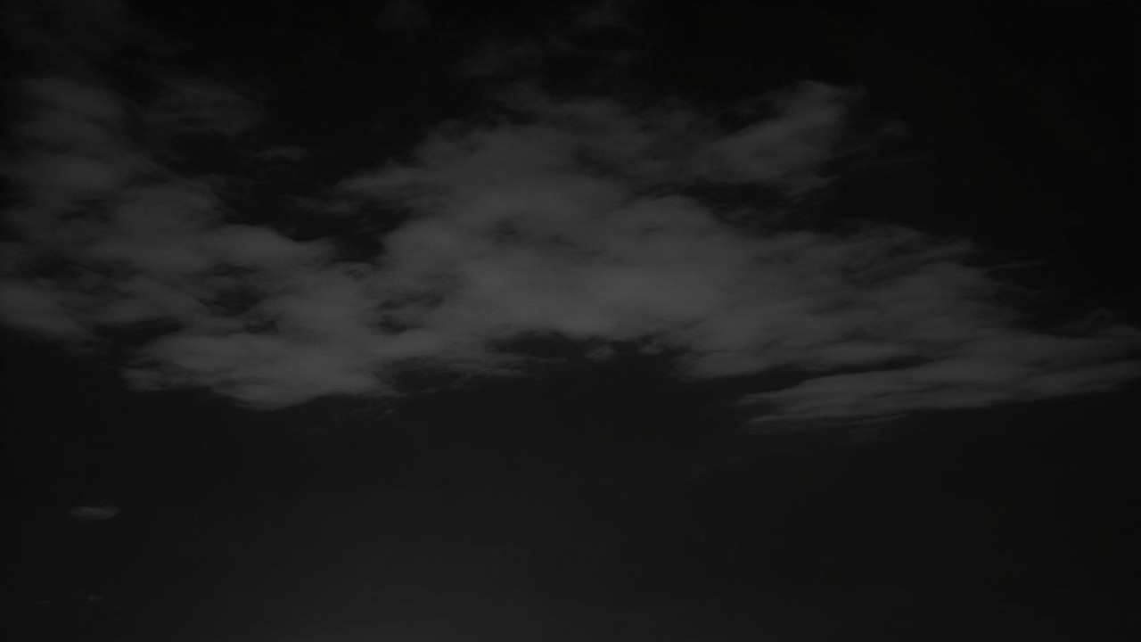 Foggy Striped Clouds at Night in Black and White