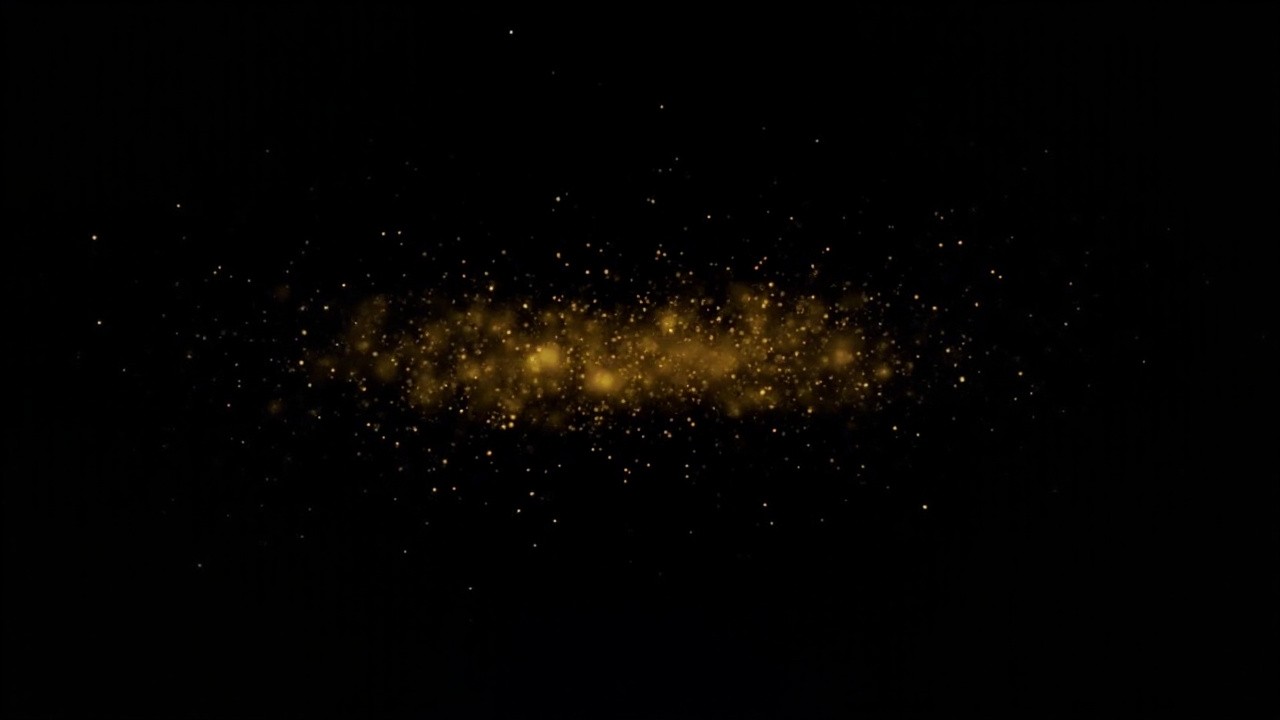 Gold Dust Particles on a Black Background